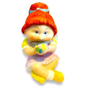 1984 Cabbage Patch Kids Porcelain Figurine Girl. Vintage Doll holding flowers.
